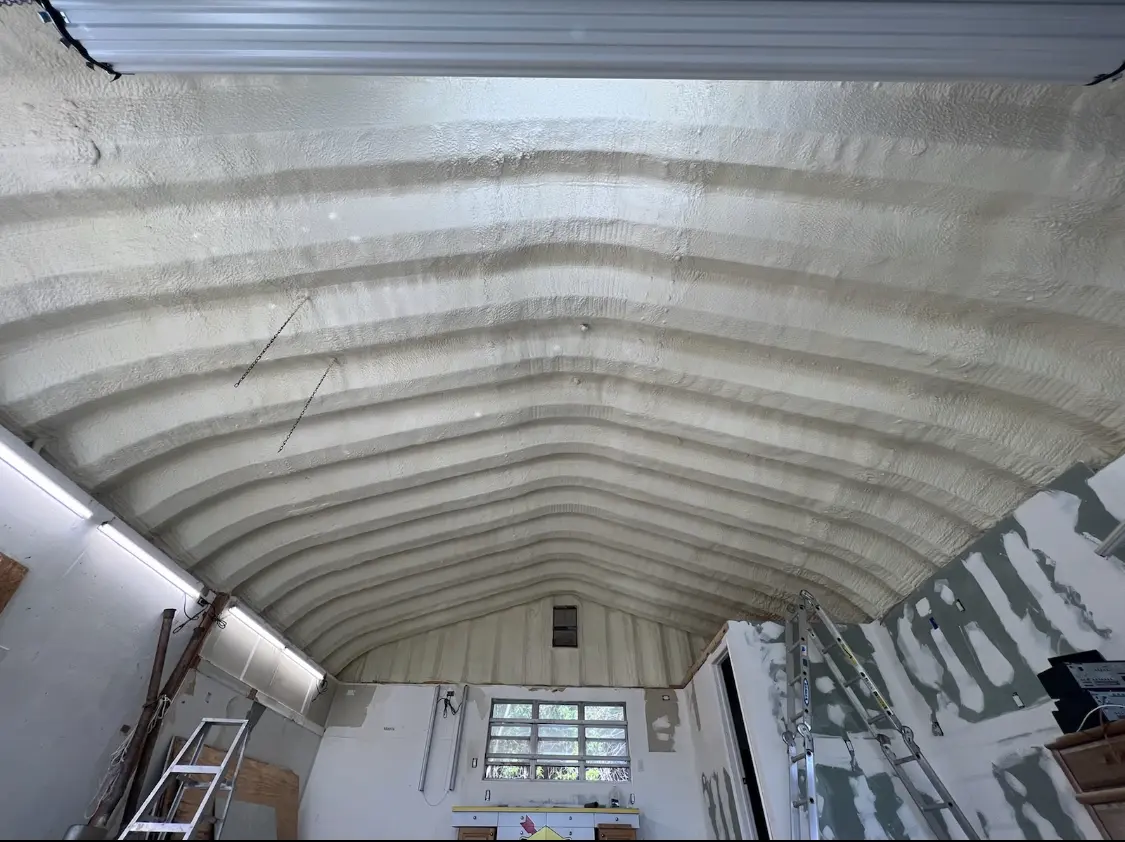Spray polyurethane foam applied to the underside of a metal roof deck in Winfield